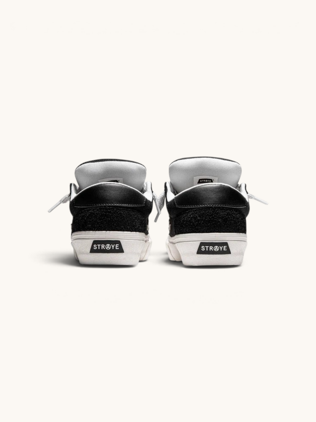 Vista trasera de los tenis FRIDAY.COM.CO Straye Dixon Logan Puff en ante negro con suela blanca y logo en el talón.