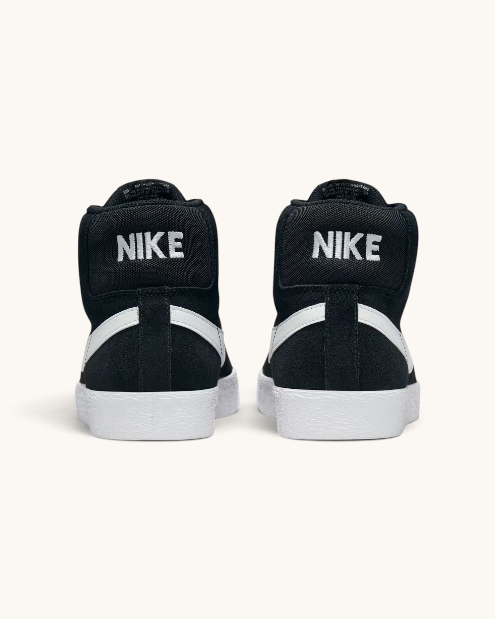FRIDAY.COM.CO Nike SB Zoom Blazer Mid sneakers in black suede with white Swoosh and heel branding, rear view.