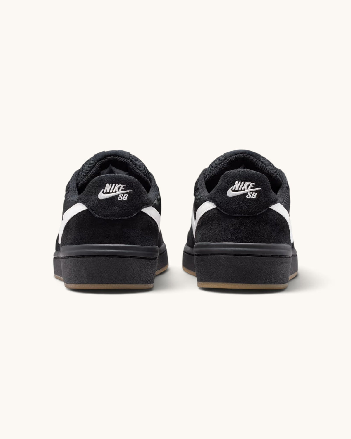 FRIDAY.COM.CO Nike SB Code 58 sneakers in black suede with white swoosh and gum rubber soles, rear view
