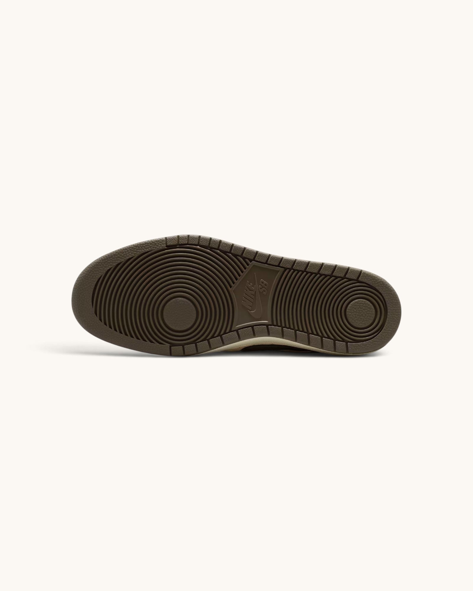 FRIDAY.COM.CO Nike SB Code 58 sneaker showing the durable brown rubber outsole with classic pivot circle pattern