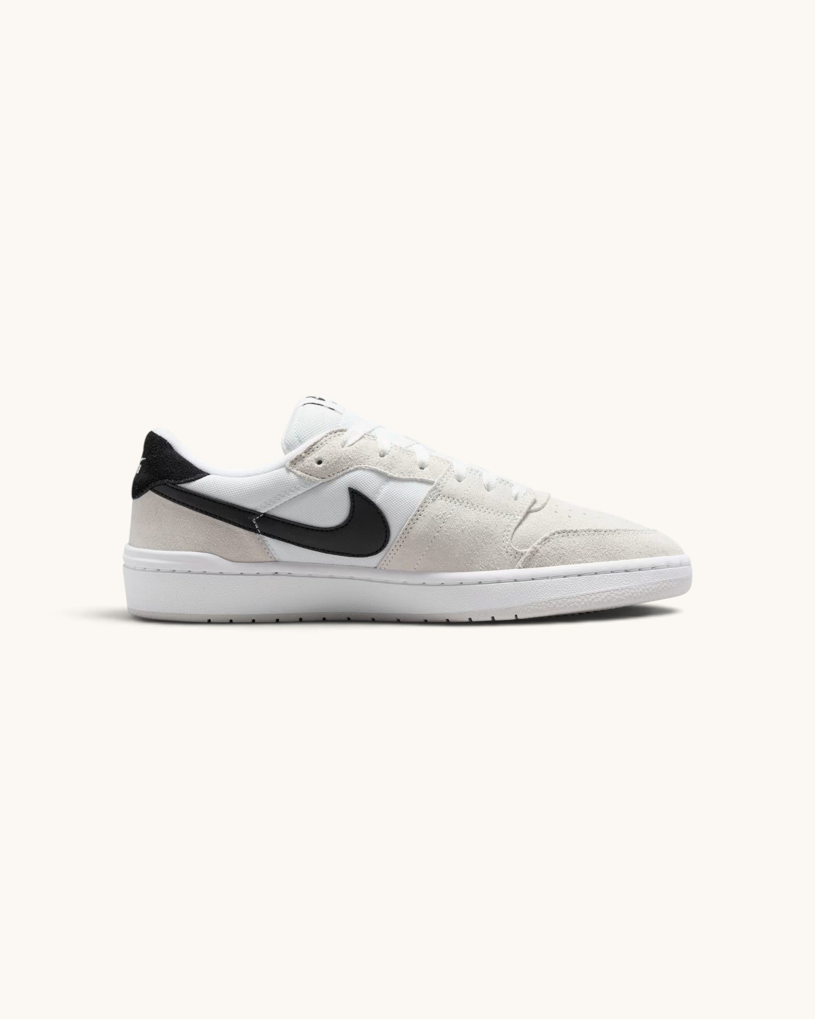 FRIDAY.COM.CO Nike SB Code 58 sneakers in summit white with black swoosh, featuring mixed suede and mesh construction.