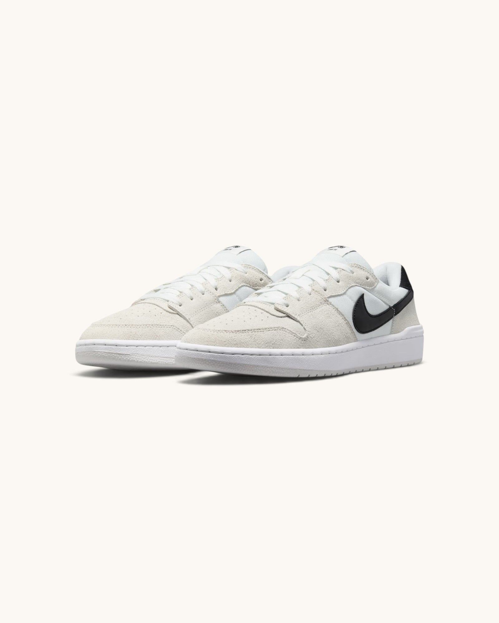 FRIDAY.COM.CO Nike SB Code 58 sneakers in summit white suede and leather with a black swoosh and cupsole construction.