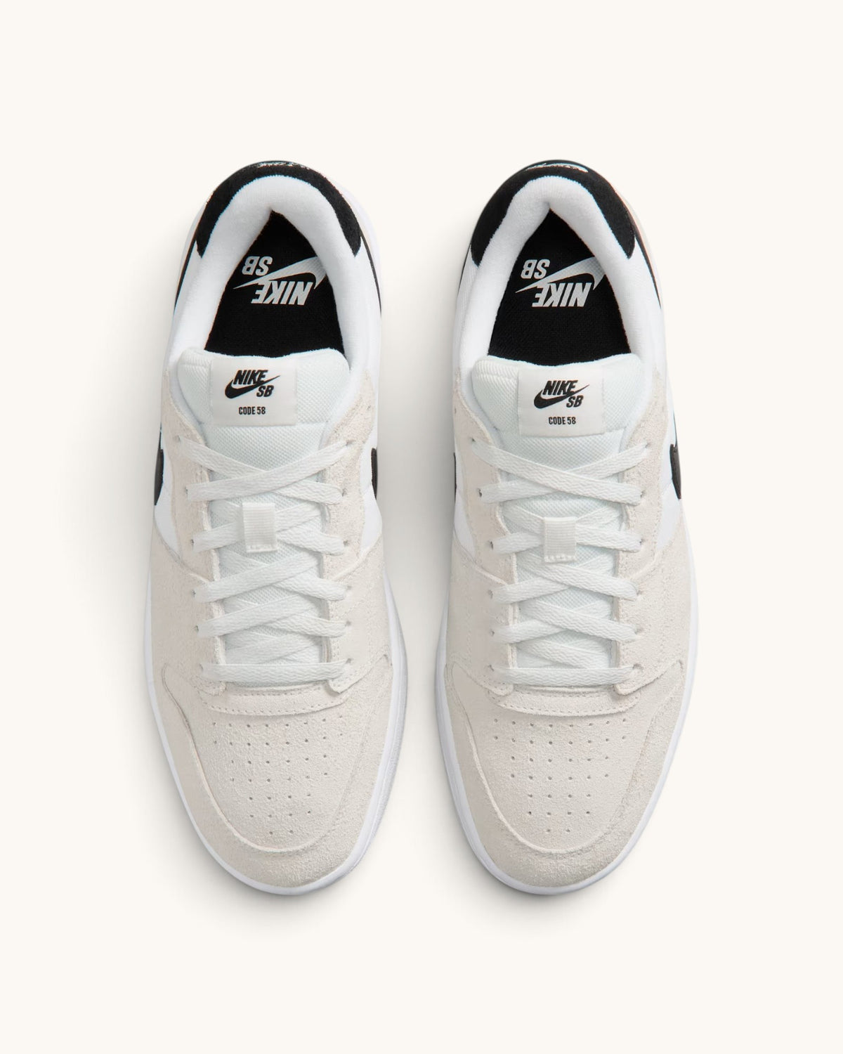 FRIDAY.COM.CO Nike SB Code 58 sneakers in summit white with black accents, featuring a mixed material cupsole design.