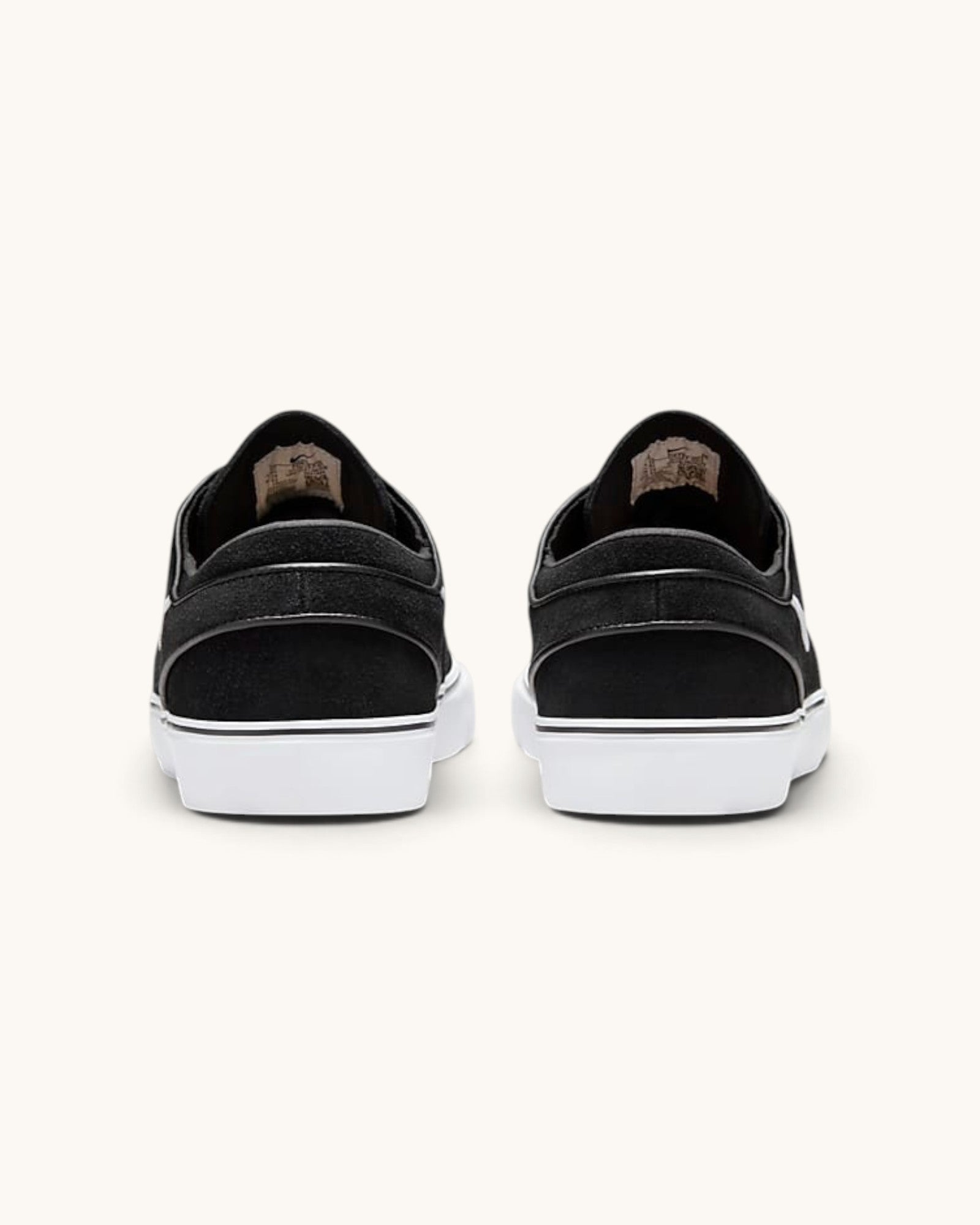 Back view of FRIDAY.COM.CO Nike SB Zoom Janoski OG+ skate shoes in black suede with white vulcanized soles.