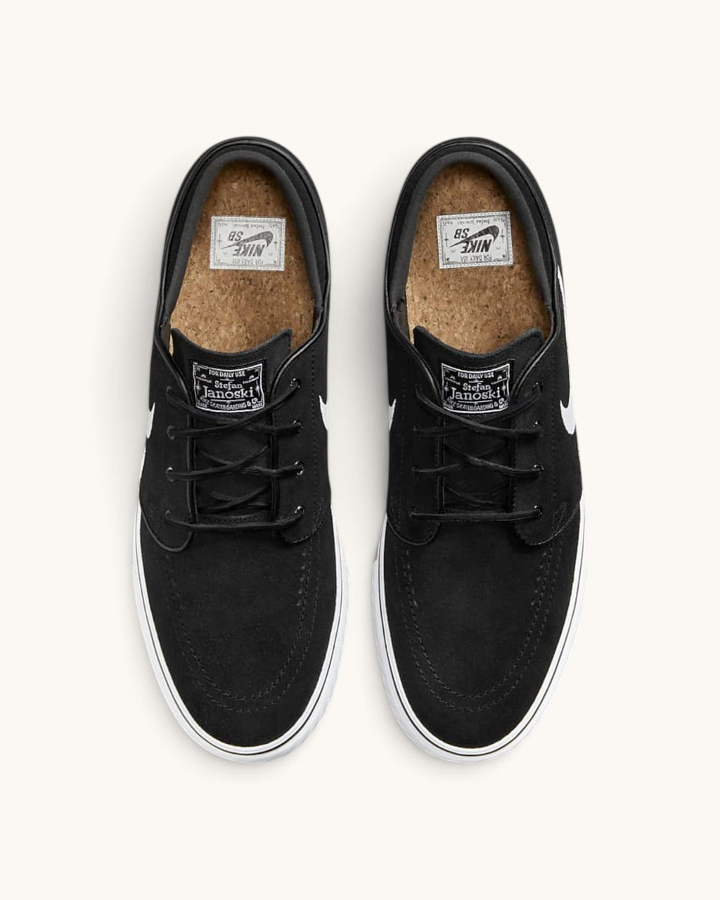FRIDAY.COM.CO Nike SB Zoom Janoski OG+ black suede skate shoes with white soles and cork insoles, top view.