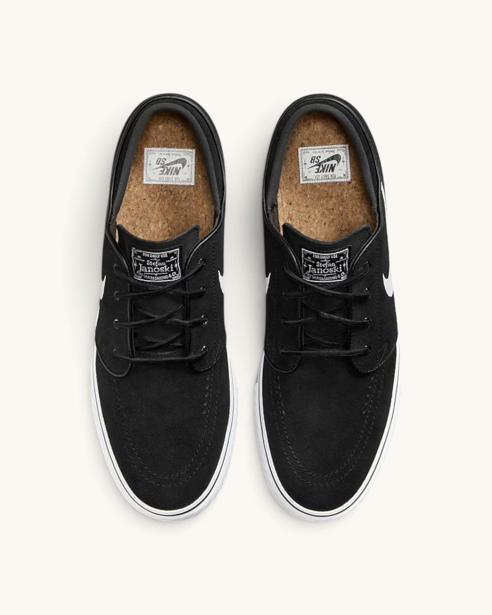 FRIDAY.COM.CO Nike SB Zoom Janoski OG+ black suede skate shoes with white soles and cork insoles, top view.