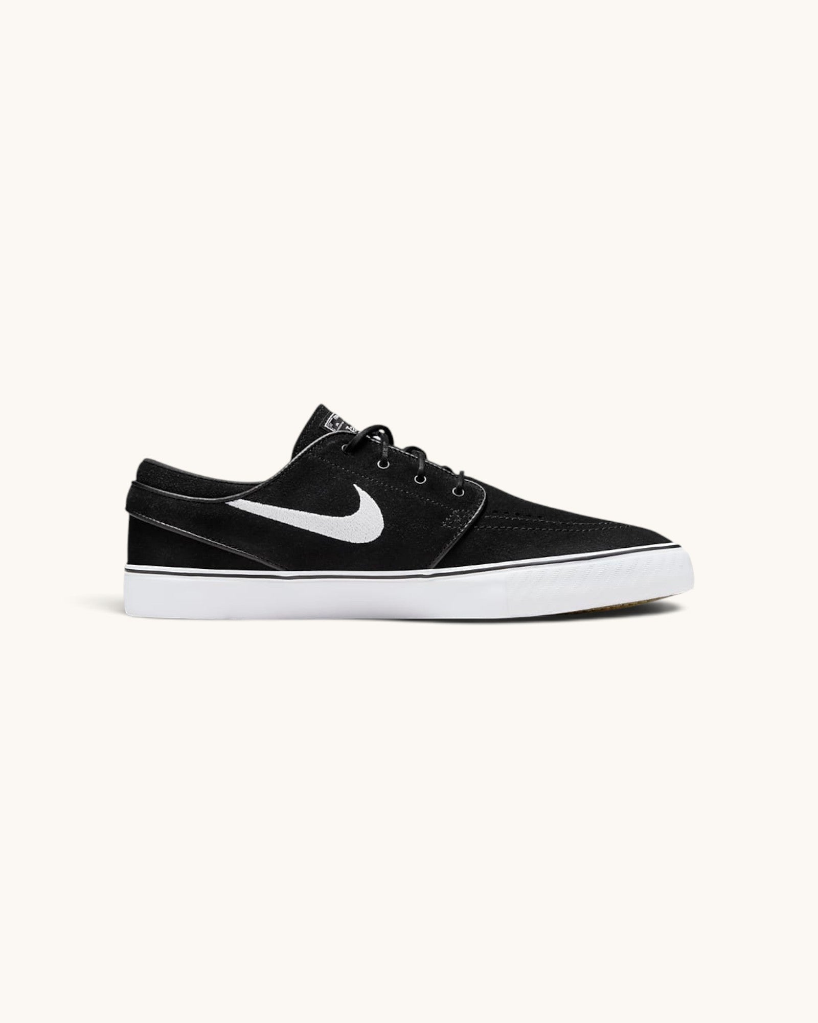 FRIDAY.COM.CO Nike SB Zoom Janoski OG+ skate shoes in black suede with a white Swoosh and vulcanized rubber sole.