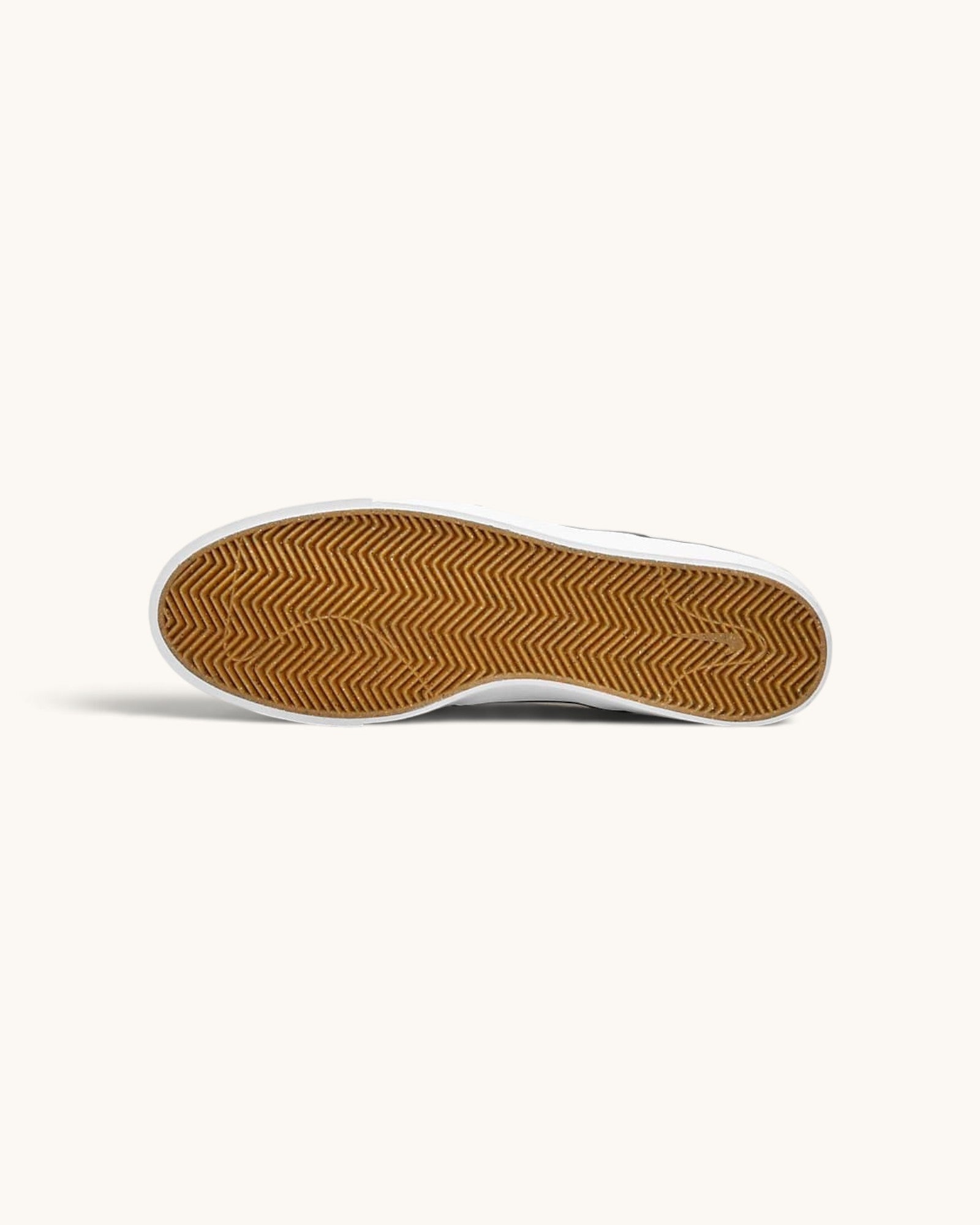 FRIDAY.COM.CO Nike SB Zoom Janoski OG+ skate shoe showing the durable gum rubber herringbone tread outsole