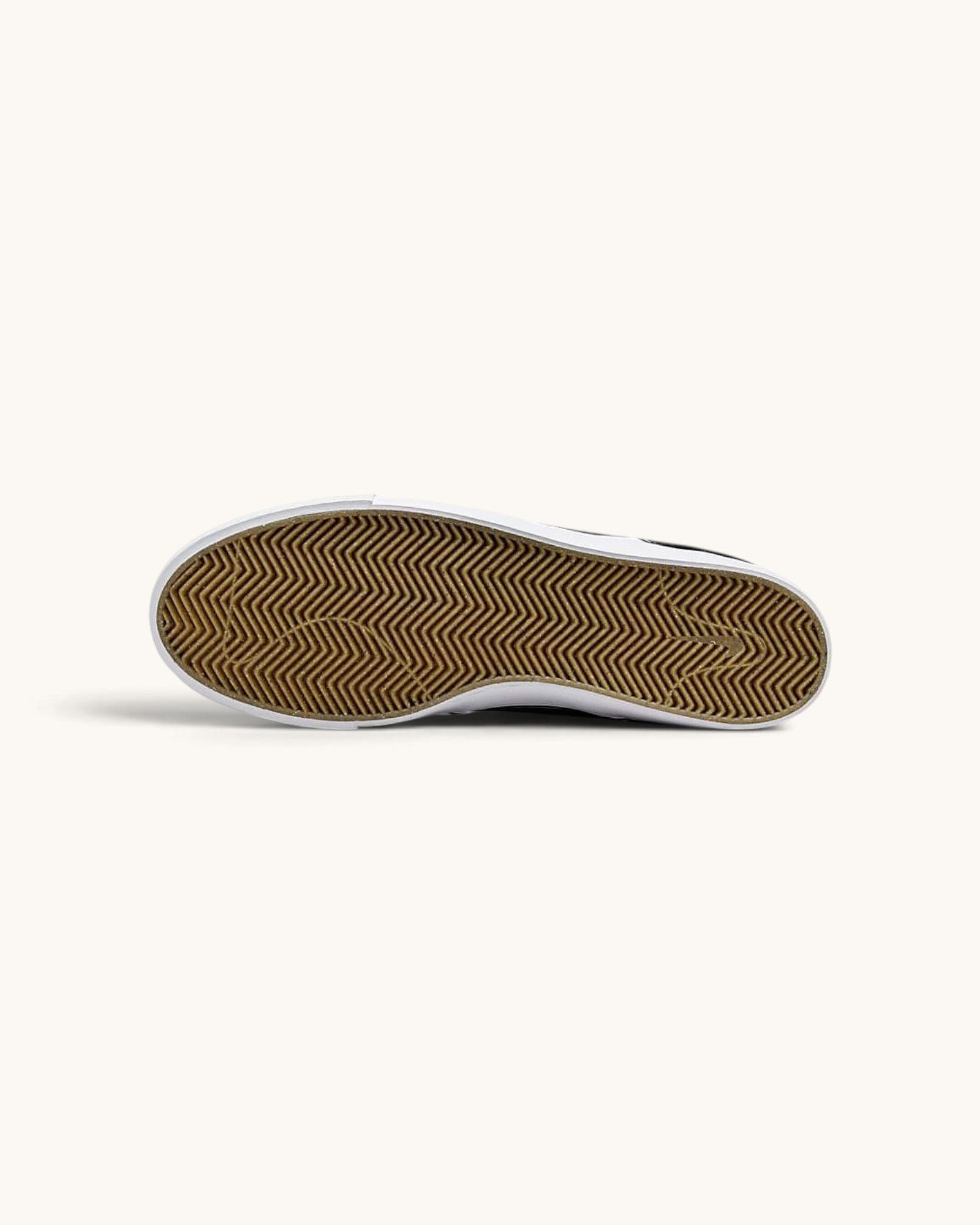 FRIDAY.COM.CO Nike SB Zoom Janoski OG+ skate shoe showing the brown herringbone traction rubber outsole