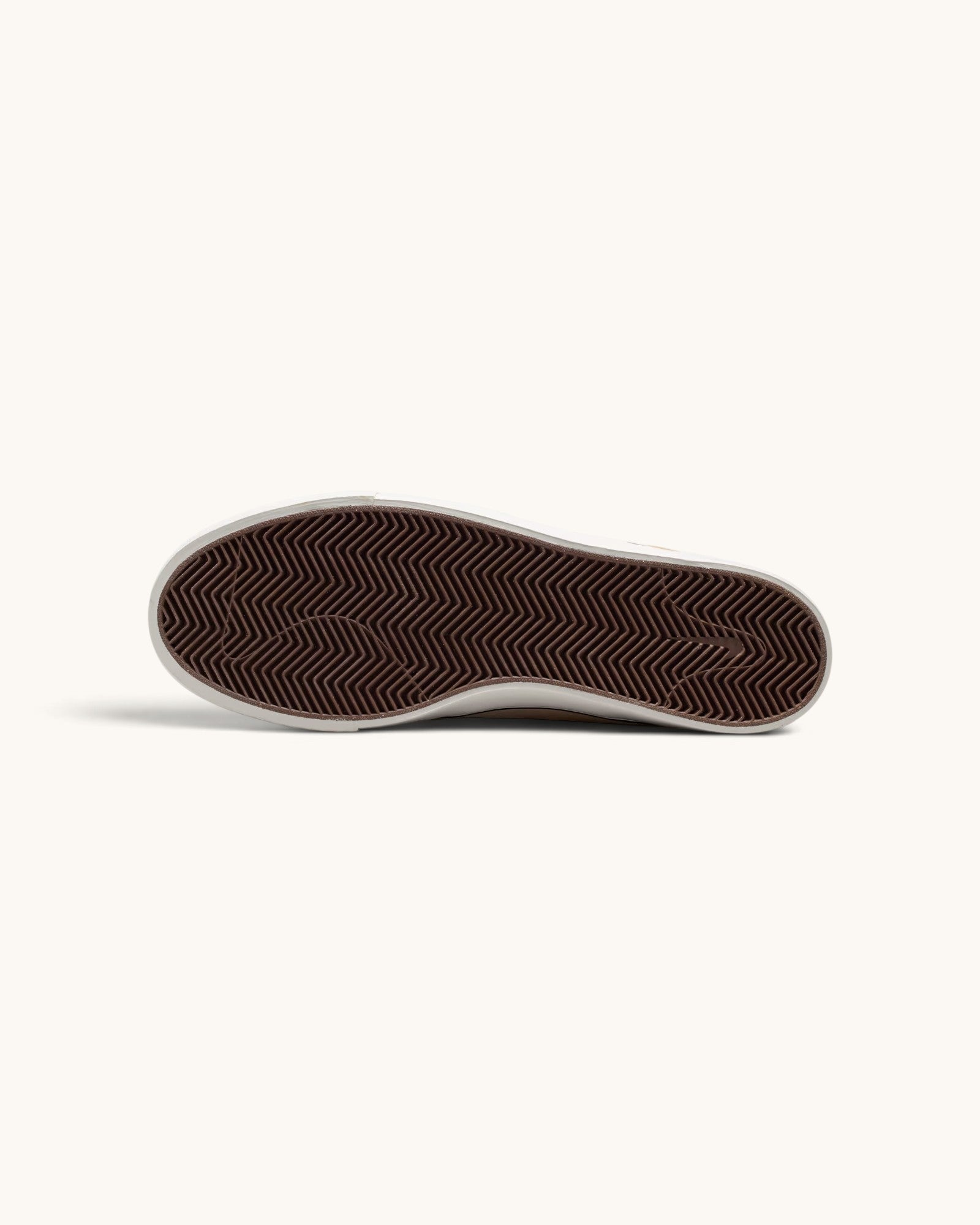 FRIDAY.COM.CO Nike SB Zoom Janoski OG+ sneaker showing the brown herringbone rubber outsole for skate grip