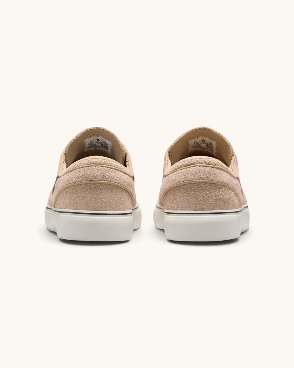 Rear view of FRIDAY.COM.CO Nike SB Zoom Janoski OG+ sneakers in light chocolate suede with white vulcanized soles.