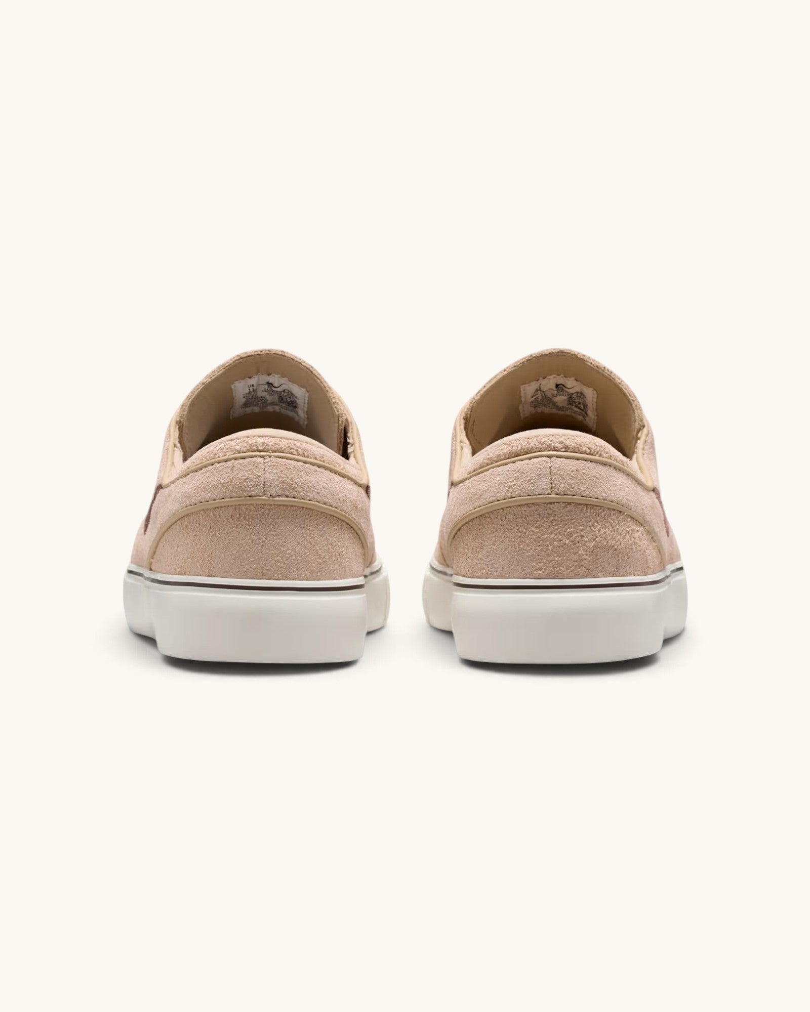 Rear view of FRIDAY.COM.CO Nike SB Zoom Janoski OG+ sneakers in light chocolate suede with white vulcanized soles.