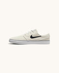 FRIDAY.COM.CO Nike SB Zoom Janoski OG+ skate shoes in off-white suede with a black Swoosh and vulcanized sole.