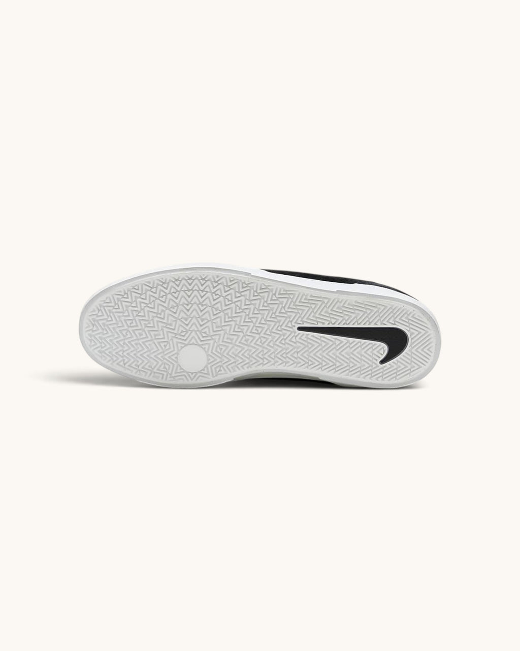 FRIDAY.COM.CO Nike SB Malor skate shoe showing the white vulcanized rubber outsole with black Swoosh branding